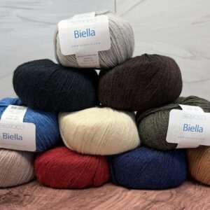 Berroco Biella DK-weight yarn in light warm gray, black, dark chocolate brown, medium blue, cream, dark olive green, light taupe, deep red, dark navy blue and warm caramel brown.