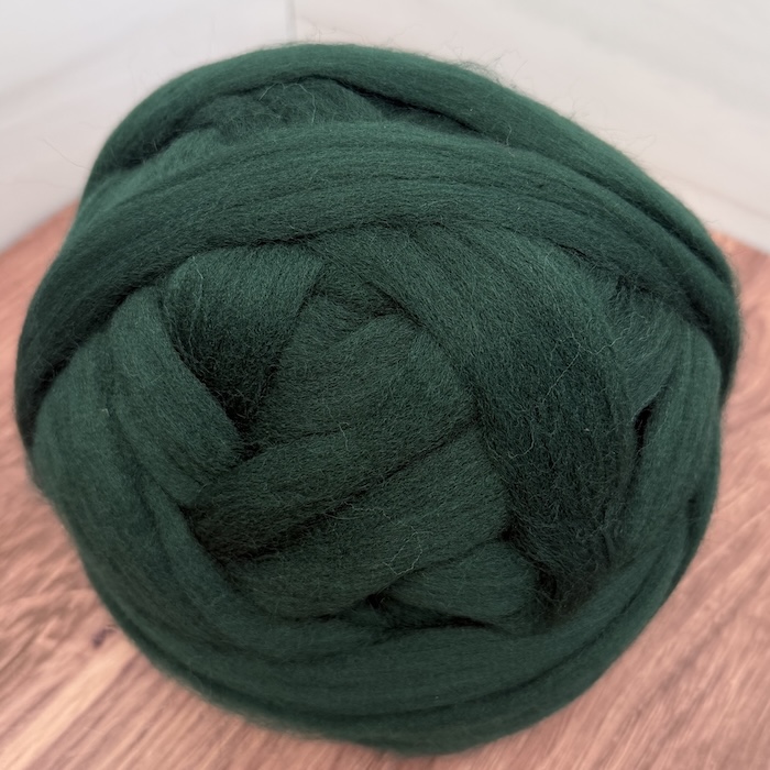Brown Sheep Dyed Wool Roving 06 Deep Pine. solid combed top.
